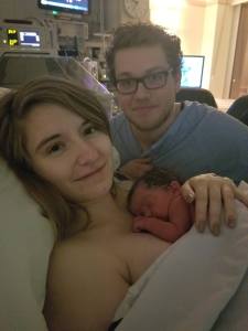 Photo of Melissa holding newborn Charlotte on her chest beside James. Taken in the NICU when we first got to be all 3 together. 